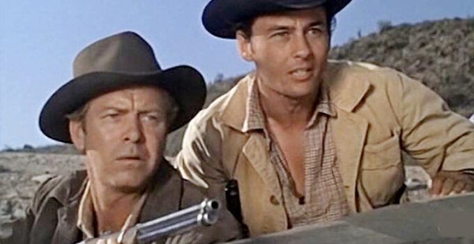 Gene Nelson as Gil Shepard and Jerry Summers as Martin Beaumont, trying to fend off an Apache attack in The Purple Hills (1961)