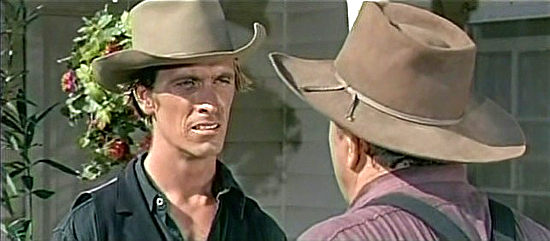 Rex Holman as Rick Morrison informs his uncle that Clint Cooper has returned to Shelby in The Quick Gun (1964)