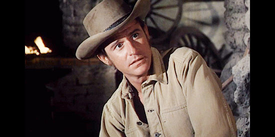 Roddy McDowell as Nick Evers, sharing his difficult upbringing with an acquaintance in Five Card Stud (1968)