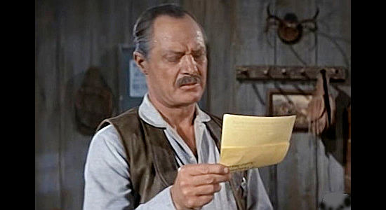 Russ Bender as the deputy, trying to figure out who deserves the bounty for A.J. Beaumont in The Purple Hills (1961)