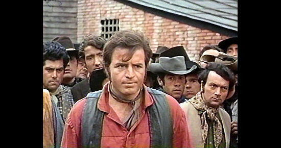 Vince Edwards as David Galt faces an angry town mob in The Desperados (1969)