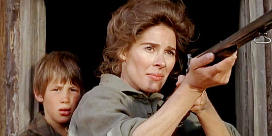 Joan Hackett as Catherine Allen, prepared to defend herself and son Horace (Jon Gries) in Will Penny (1967)