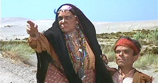 Freda Jackson as Tia Zortna issues a warning about Gwangi with Jose Burgos as The Dwarf in The Valley of Gwangi (1969)
