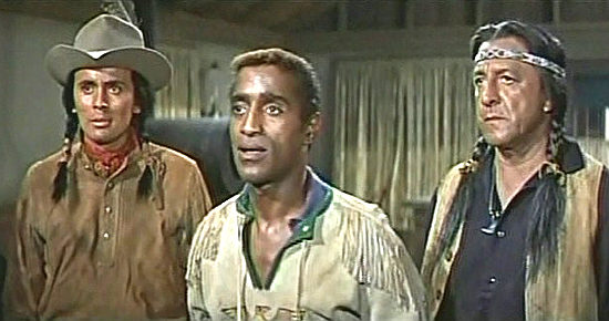 Sammy Davis Jr. as Jonah Williams shares news of Sgt. Deal's capture, flanked by scouts Caleb (Armand Alzamora) and Willie Sharpknife (Buddy Lester) in Sergeants 3 (1962)