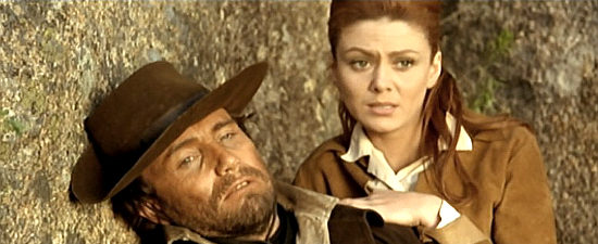 Anthony Steffen as Regan with Gloria Osuna as Sally Norton, in a tight spot in Some Dollars for Django (1966)