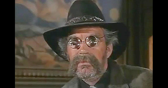 Jack Elam as bounty hunter Kittrick in The Cockeyed Cowboys of Calico County (1970)