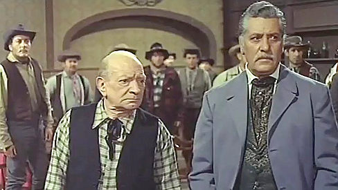 Luigi Barbieri as Piluk with Fedele Gentile as the saloon owner in Gun Shy Piluk (1968)