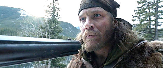 Tom Hardy as Tom Fitzgerald finds himself at the wrong end of a musket in The Revenant (2015)