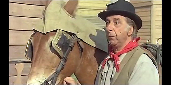Lugii Bonos (Gigi Bonos) as Timothy, the nuns' driver, with his horse Frederica in For a Book of Dollars (1973)