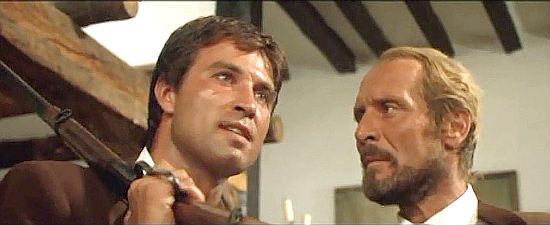 Peter Martell (Pietro Martellanza) as Rodrigo Campos and Piero Lulli as Sheriff Coope discuss an arranged marriage in Ride for a Massacre (1967)