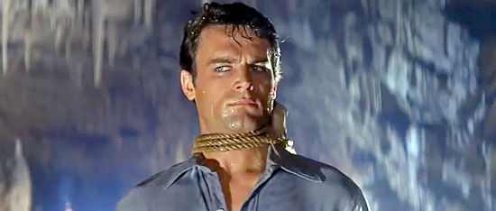 Terence Hill (Mario Girotti) as Toby, in need of a rescue, in Flaming Frontier (1965)