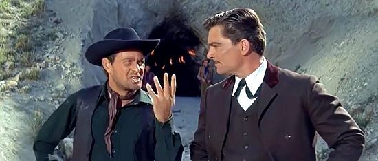 Voja Miric as Joe and Larry Pennell as Gen. Jack O'Neille discuss splitting a gold mine in Flaming Frontier (1965)