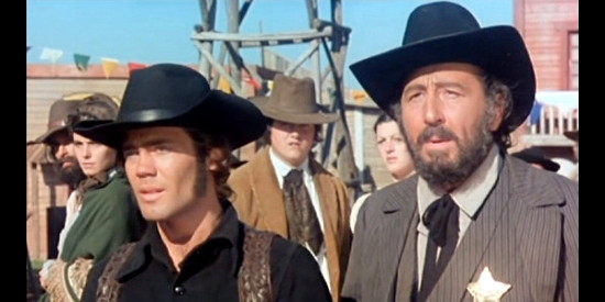 Benjamin Lev as the deputy and Pino Ferrara as the sheriff sense trouble coming to town in Carambola's Philosophy, In the Right Pocket (1975)