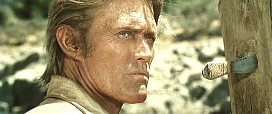 Chuck Connors as Clyd McKay about to face some old friends in Kill Them All and Come Back Alone (1968)