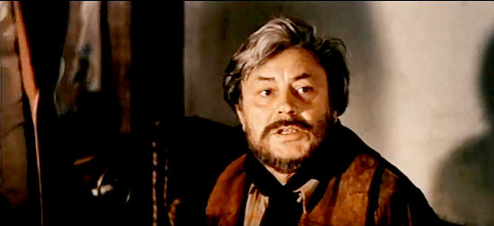 Donatas Banionis as GabrielConroy, the prospector in Armed and Dangerous (1978)