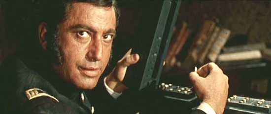 Frank Wolff as Capt. Lynch, plotting to get his hands on the gold in Kill Them All and Come Back Alone (1969)