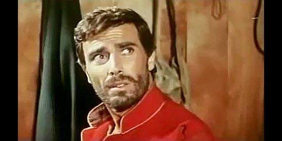 George Hilton as Kitosch, posing at Maj. Baker in Kitosch, the Man Who Came from the North (1967)