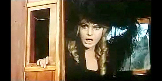 Krista Nell as Eva, shocked that a man would rob the dead of their clothes in Kitosch, the Man Who Came from the North (1967)