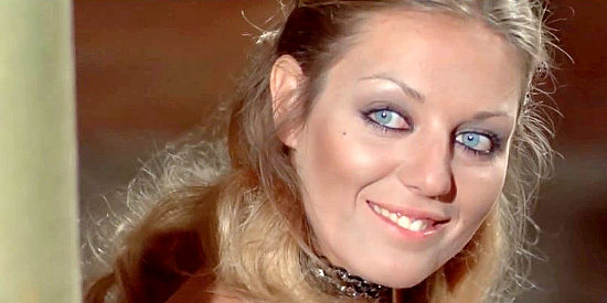 Simone Blondell as saloon girl too, flashing her smile in Anything for a Friend (1973)