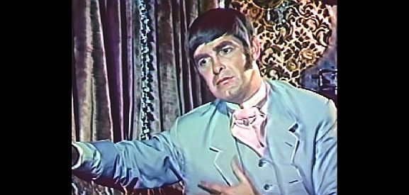 Derek Nimmo, a traveling salesman with eyes for Evalina in A Talent for Loving (1969)