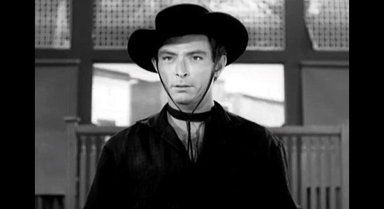 Lee Van Cleef as Frank Emmett, a fast gun standing in the way of Ross Haney's plans in Treasure of Ruby Hills (1955)