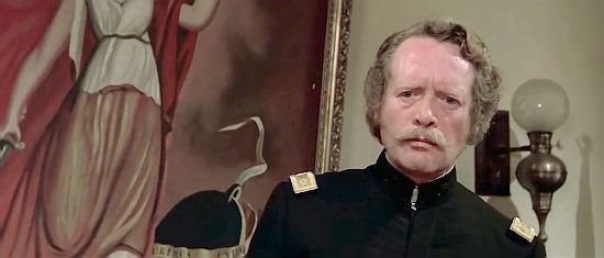 Patrick McGoohan as Major Cabot, the cavalry commander with an unquenchable greed in A Genius, Two Partners and a Dupe (1975)