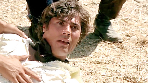 Pietro Torrisi as Sam Garrison, pulling off a ruse in Fighters of Ave Maria (1970)