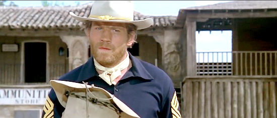 Raimund Harmstorf as Sgt. Milton, the major's second in command in A Genius, Two Partners and a Dupe (1975)