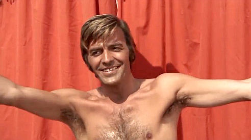 Tony Kendall as Tony Garrison during his acrobatic act in Fighters of Ave Maria (1970)
