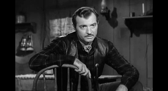 Zachary Scott as Ross Haney, the man secretly gaining control of the water rights around Soledad in Treasure of Ruby Hills (1955)