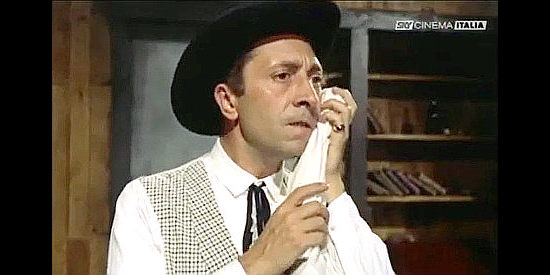Aroldo Tieri as Fats Missouri, nursing another sore tooth in Terrible Sheriff (1962)