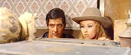 Carlos Quinely (Montgomery Hood) as Allan (Cjamango) and Claudia Gravy as Peggy wait for a safe to blow in Adios Cjamango (1970)