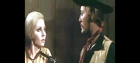 Cesar Garcia as the bandit Darby, with Helen Brice (Dyanik Zurakowska) at gunpoint in $20,000 for Every Corpse (1971)