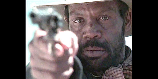 Danny Glover as 1st Sgt. Washington Wyatt, with an enemy under his gunsight in Buffalo Soldiers (1997)