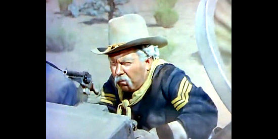 Edgar Buchanan as Sgt. Chips, under attack in Buffalo Bill (1944)