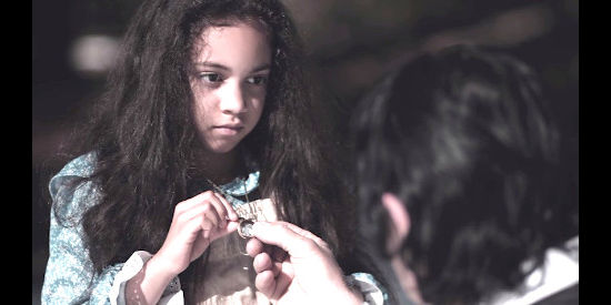 Jadzia Perez as Daisy, the young kidnap victim in Once Upon a Time in Deadwood (2019)