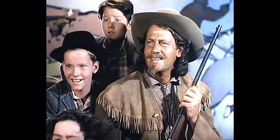 Joel McCrea as Buffalo Bill Cody, surrounded by young admirers in Buffalo Bill (1944)