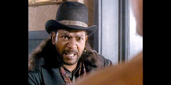 Julius Carry as Lord Bowler, a bounty hunter competing with Brisco for business in The Adventures of Brisco County Jr. (1993)