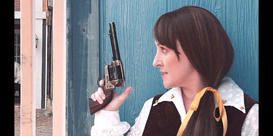 Kathy Searle as Zoe Tilghman, a sheriff's wife not afraid of gunplay in The Marshal (2019)