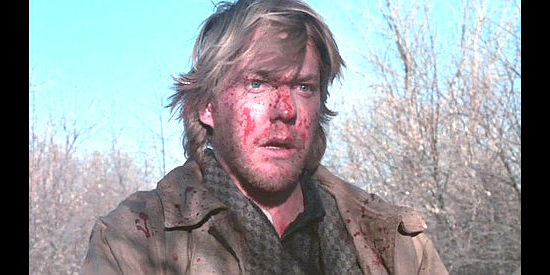 Kiefer Sutherland as Doc Scurlock, one of the regulators in Young Guns (1988)