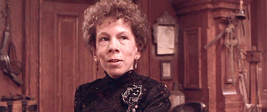 Linda Hunt as Stella, manager of Cobb's saloon in Silverado (1985)