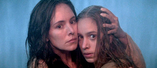 Madeleine Stowe as Cora Munro comforts younger sister Alice as the Huron approach in Last of the Mohicans (1992)