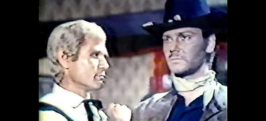 Mario Novelli (Anthony Freeman) as Dakota has a disagreement with one of Lead's allies in A Gunman Called Dakota (1972)