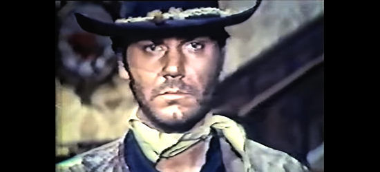 Mario Novelli (Anthony Freeman) as Dakota, the stranger who rides into town in A Gunman Called Dakota (1972)