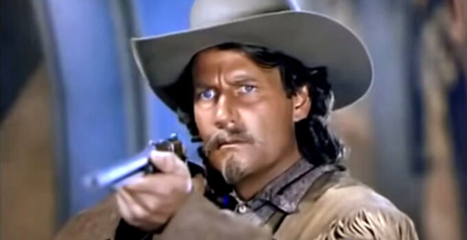 Joel McCrea as Buffalo Bill, about to shoot a penny from between a lady's fingers in Buffalo Bill (1944)