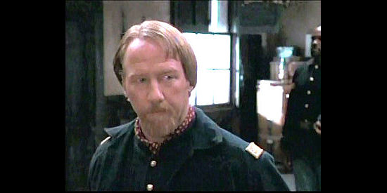 Timothy Busfield as Maj. Robert Carr, the officer who thinks leading black troopers will ruin his career in Buffalo Soldiers (1997)
