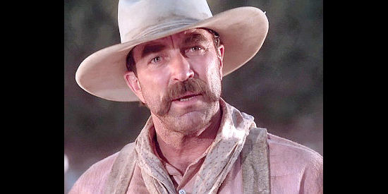 Tom Selleck as Paul Cable, looking to steer clear of trouble in Last Stand at Saber River (1997)