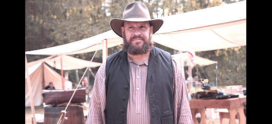 Trace Cheramie as George Washington Jr., a member of The Saint's gang in The Warrant (2020)