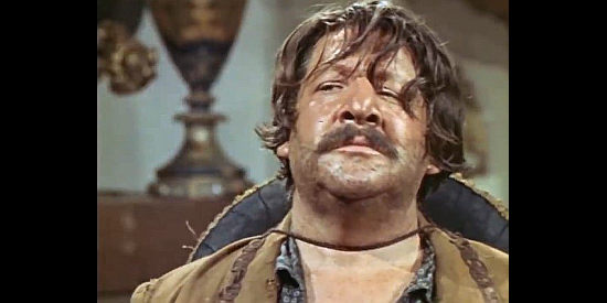 Fernando Sancho as Pablo Reyes, unimpressed by the news he's receiving in The Man Who Came to Kill (1965)