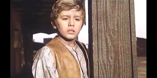 Loris Loddi as the boy orphaned by Ramon's bandits in Degueyo (1965)